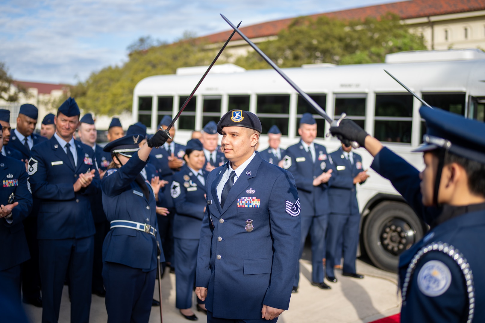 Production recruiter, Tech Sgt. Franklin Angel walks under arched swords and into the Air Force Recruiting Service headquarters building at Joint Base San Antonio-Randolph on March 19, 2024.