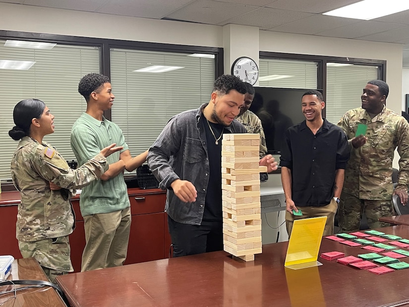 Soldiers with the 6th Military Police Company, 22nd MP Battalion enjoyed some laughs as they completed games for team points during an Army Emergency Relief Financial Literacy Challenge March 22.