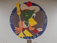 A painting of the Minot Curling Club logo is displayed at the Minot Curling Club, Minot, North Dakota, March 19, 2024. The Minot Curling Club was established in 1905 and provides a venue for members of the Minot AFB Curling League to compete. (U.S. Air Force photo by Airman 1st Class Kyle Wilson)