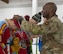 U.S. Air Force Col. Kenneth McGhee, 91st Missile Wing commander (right), presents medals to members of the Minot Air Force Base Curling League at the Minot Curling Club, Minot, North Dakota, March 19, 2024. McGhee attended the Minot AFB Curling League’s championship game and presented medals to the teams competing. (U.S. Air Force photo by Airman 1st Class Kyle Wilson)