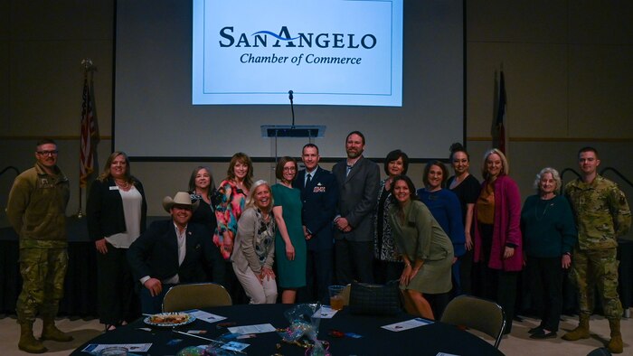 17th Training Wing honorary commanders take a photo with 17th TRW leadership during the San Angelo Chamber of Commerce State of Goodfellow luncheon at the McNease Convention Center, San Angelo, Texas, Mar. 19, 2024. The Honorary Commander Program is used to immerse local community leaders in the mission of Goodfellow Air Force Base.  (U.S. Air Force photo by Airman 1st Class Evelyn J. D’Errico)