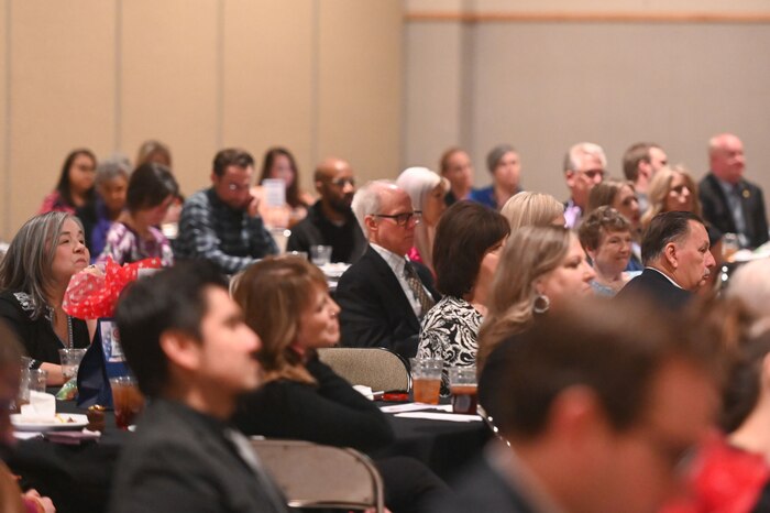 San Angelo Chamber of Commerce members listen to U.S. Air Force Col. Christopher Corbett, 17th Training Wing deputy commander, give a speech during the San Angelo Chamber of Commerce State of Goodfellow luncheon at the McNease Convention Center, San Angelo, Texas, Mar. 19, 2024. The luncheon allowed attendees to hear updates from various San Angelo community members and 17th Training Wing representatives. (U.S. Air Force photo by Airman 1st Class Brian Lummus)
