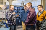 Matt Moyer, branch head, Code 135.1, Quality Assurance, Non- Destructive Testing, discusses eddy currents with Warren Herrington, Joseph Hughes, and Robert Kollman, Feb. 15, 2024, at Puget Sound Naval Shipyard & Intermediate Maintenance Facility in Bremerton, Washington. (U.S. Navy photo by Jeb Fach)