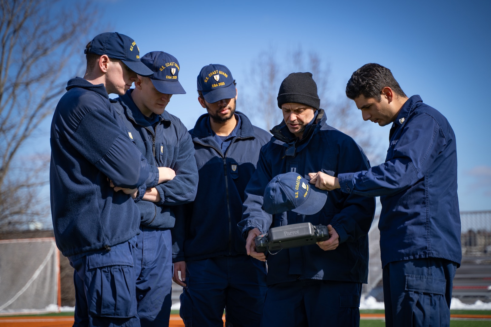 Lt. Kevin Deninger, Office of Aeronautical Engineering, demonstrates remote operations to cadets during a training course at the Coast Guard Academy, New London, Conn, Feb 21, 2023. The Coast Guard Short Ranged Unmanned Aerial Systems (SR-UAS) program is designed to create designated pilots and integrate drone capabilities into various missions. (U.S. Coast Guard photograph by Petty Officer 3rd Class Matt Thieme)