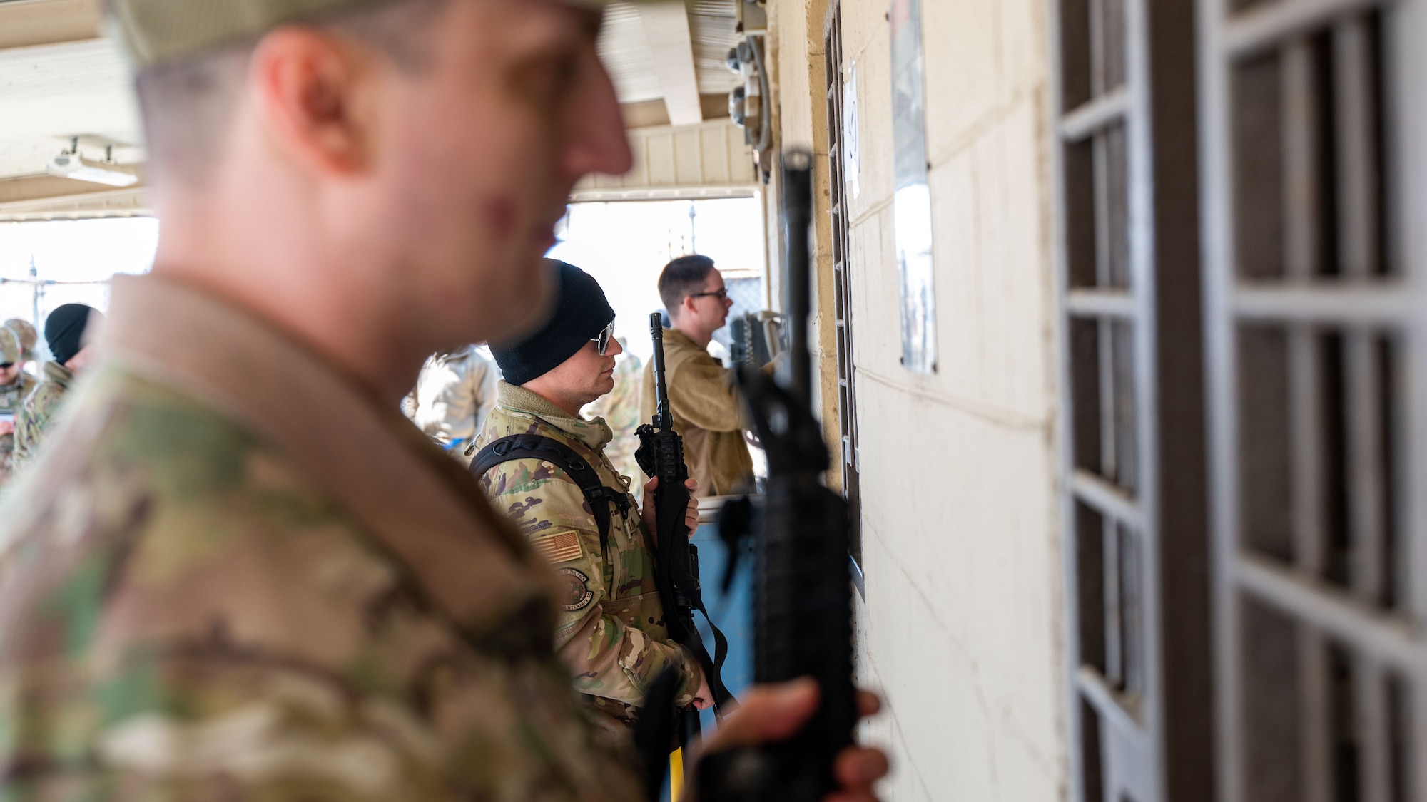 Senior Airman Jakob Lundin accepts an M4 carbine rifle in preparation for Beverly Sentinel 24-1.