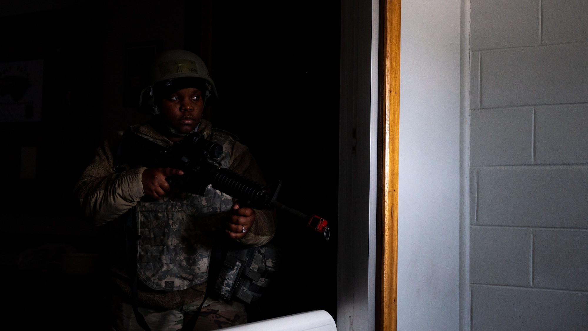 Senior Airman Kianna Parrish olds a defense position during a simulated group attack.