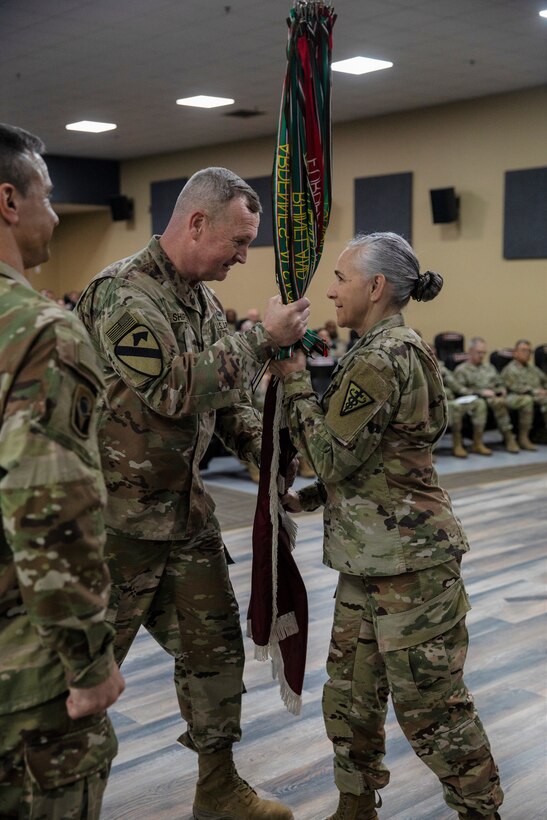 MG Eric P. Shirley hands guidon to Col. Renn Polk