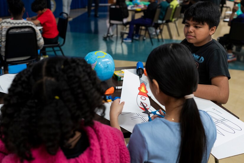 Students at Takoma Elementary School build toy rockets