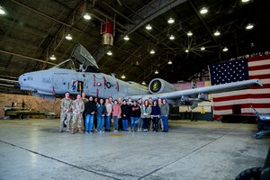 Spouses from the 51st Fighter Wing pose for a group photo during a spouse immersion tour at Osan Air Base, Republic of Korea, March 20, 2024.