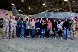 Spouses from the 51st Fighter Wing pose for a photo during a spouse tour at Osan Air Base, Republic of Korea, March 20, 2024.