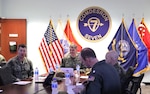 SINGAPORE (March 22, 2024) - Vice Adm. Fred Kacher, right, Commander, U.S. 7th Fleet is greeted by Chief Operations Specialist Jeremy Harris during a visit to Commander, Destroyer Squadron (DESRON) 7 , March 22. As the U.S. Navy’s destroyer squadron forward-deployed in Southeast Asia, DESRON 7 serves as the primary tactical and operational commander of littoral combat ships rotationally deployed to Singapore, Expeditionary Strike Group 7’s Sea Combat Commander and builds partnerships through training exercises and military-to-military engagements. (U.S. Navy photo by Lt. j.g. Rebecca Moore)