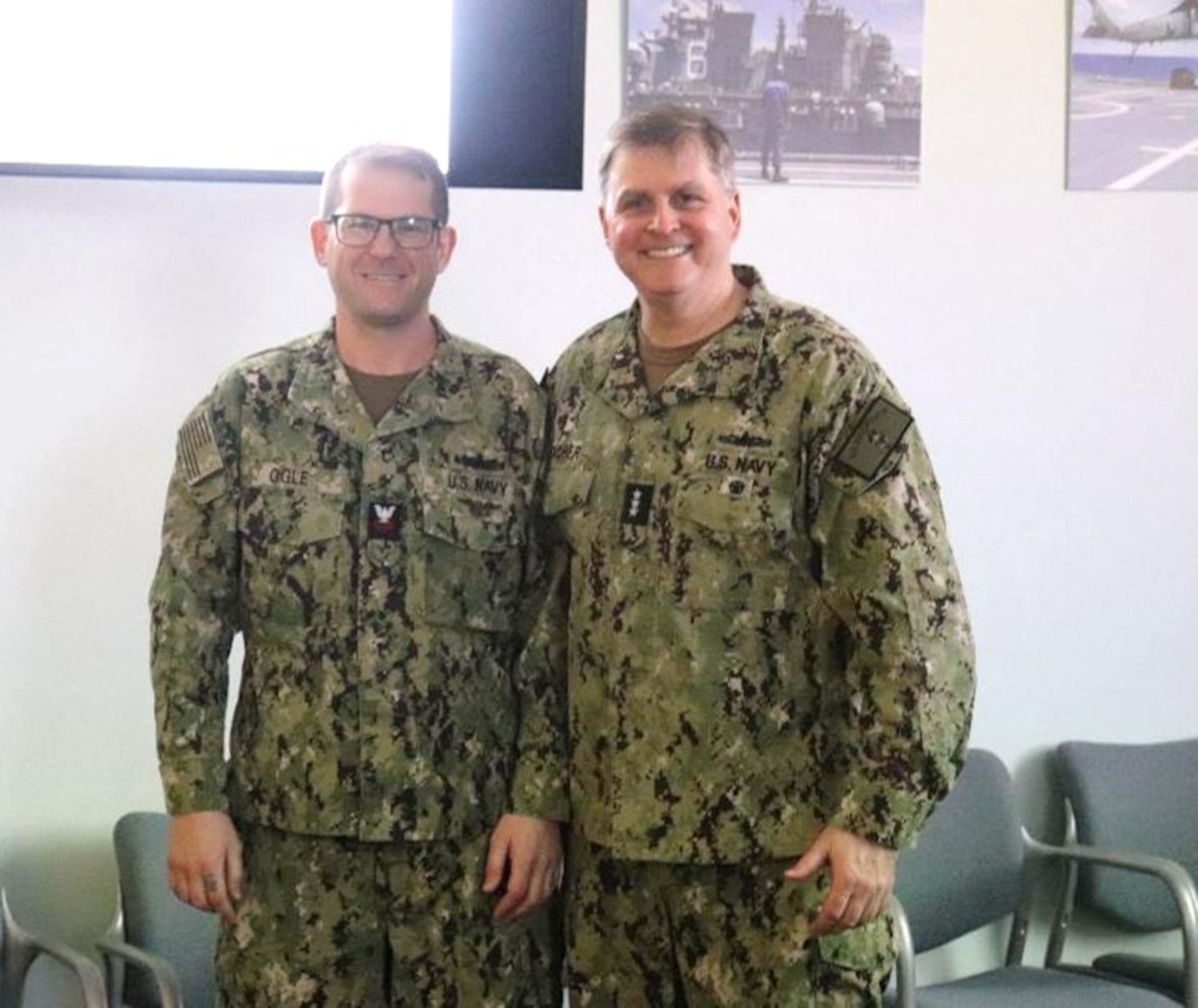 SINGAPORE (March 22, 2024) - Vice Adm. Fred Kacher, Commander, U.S. 7th Fleet (center) poses for a photo with Commander, Destroyer Squadron (DESRON) 7, Sailor of the Year, Gunner’s Mate 1st Class Daniel Ogle, March 22. As the U.S. Navy’s destroyer squadron forward-deployed in Southeast Asia, DESRON 7 serves as the primary tactical and operational commander of littoral combat ships rotationally deployed to Singapore, Expeditionary Strike Group (ESG) 7’s Sea Combat Commander and builds partnerships through training exercises and military-to-military engagements. (U.S. Navy photo by Lt. j.g. Rebecca Moore)