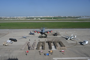 NATO partners from Türkiye, the U.S., Poland and Spain stand together to celebrate NATO’s 75th founding anniversary, at Incirlik Air Base, Türkiye, March 28, 2024. They are standing in formation to spell out NATO.