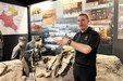 U.S. Army Staff Sgt. John Mateja, the religious affairs NCO of U.S. Army Garrison Poland, shows tour guests a visual of the battlefield at the Museum of the Wielkopolska Uprising of 1918-1919 in Poznan, Poland, March 15, 2024. Mateja guided U.S. Army Soldiers through this museum for them to see for themselves the authentic artifacts and historical replicas that represent Polish history of independence. (U.S. Army photo by Staff Sgt. Jameson Harris)