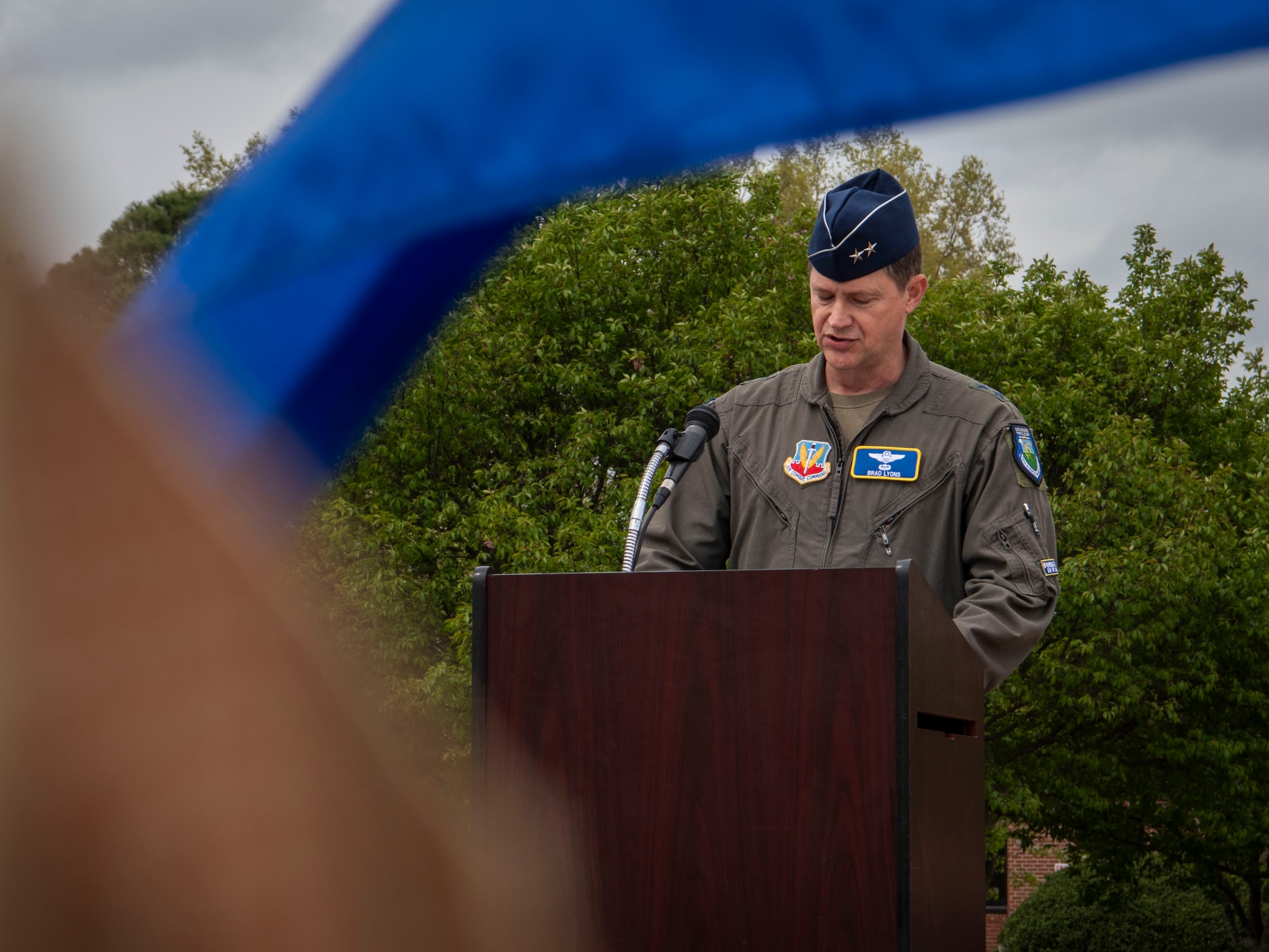 Maj. Gen. David Lyons, Fifteenth Air Force commander, highlights the accomplishments of the out-going commander during the 4th Fighter Wing change of command, at Seymour Johnson Air Force Base, North Carolina, March 22, 2024. Change of command ceremonies are a long-standing military tradition that symbolizes the official transfer of power and duties from the departing commander to the incoming commander. (U.S Air Force photo by Senior Airman Sabrina Fuller-Judd)