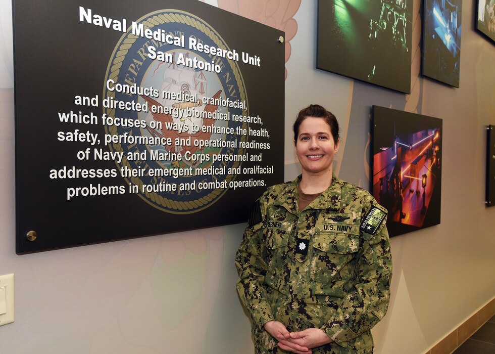 JOINT BASE SAN ANTONIO-FORT SAM HOUSTON – (March 27, 2024) – One of the highly professional women within Navy Medicine is Cmdr. Rachel Werner, Dental Corps, Naval Medical Research Unit (NAMRU) San Antonio’s acting chief science director. Born and raised in Cocoa Beach, Fla., Werner has been serving in America’s Navy for 15 years with the active-duty force, first being commissioned in the Navy Reserve as an ensign in 2005. Before attending dental school at the University of Missouri at Kansas City, Werner was recruited for service in the Navy Dental Corps through the Health Professions Scholarship Program (HPSP).  Approximately 50 percent of NAMRU San Antonio’s military and support personnel is comprised of women. Therefore, it is fitting that the 2024 theme of Women's History Month be “Women Who Have Made Great Achievements.” NAMRU San Antonio’s mission is to conduct gap driven combat casualty care, craniofacial, and directed energy research to improve survival, operational readiness, and safety of Department of Defense (DoD) personnel engaged in routine and expeditionary operations. It is one of the leading research and development laboratories for the U.S. Navy under the DoD and is one of eight subordinate research commands in the global network of laboratories operating under the Naval Medical Research Command in Silver Spring, Md. (U.S. Navy photo by Burrell Parmer, NAMRU San Antonio Public Affairs/Released)