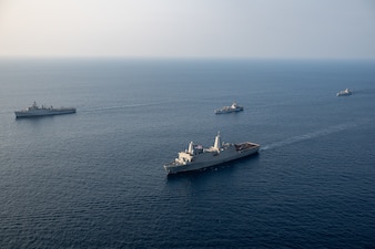 USS Somerset (LPD 25) leads a formation of US and Indian navy ships in the Bay of Bengal.