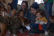 U.S. Marine Corps Pfc. Bruno, the Marine Corps Recruit Depot San Diego and Western Recruiting Region mascot, greets guests during a MCRD Library Spring Storytime event at MCRD San Diego, California, March 27, 2024. The mascot’s job is to boost morale, participate in outreach work, and attend events and ceremonies. (U.S. Marine Corps photo illustration by Lance Cpl. Janell B. Alvarez)