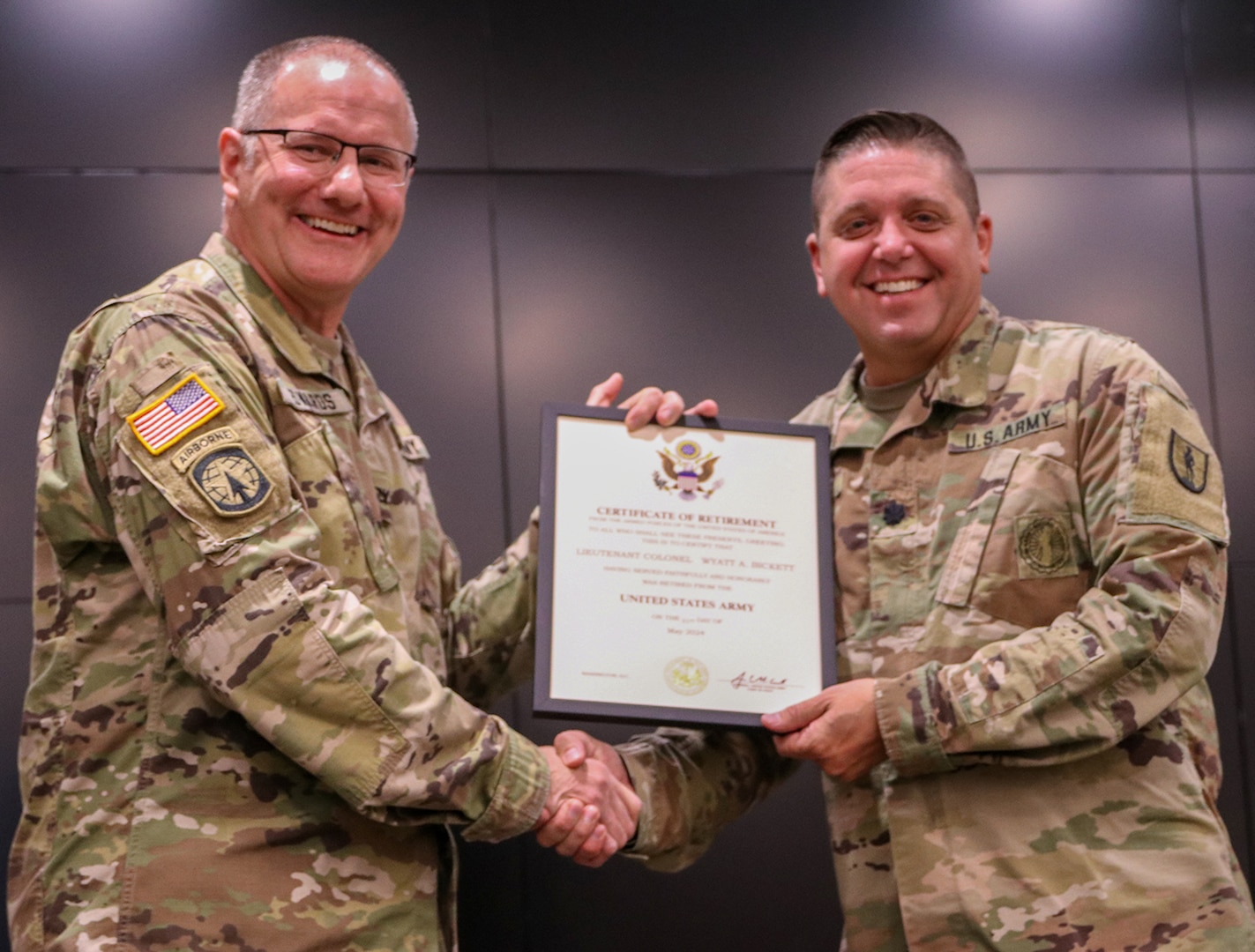 Lt. Col. Wyatt Bickett, of Smithton, officer in charge of the 129th Regiment (Regional Training Institute) is presented a certificate of retirement by Col. Randy Edwards, Chief of Staff, Illinois Army National Guard.