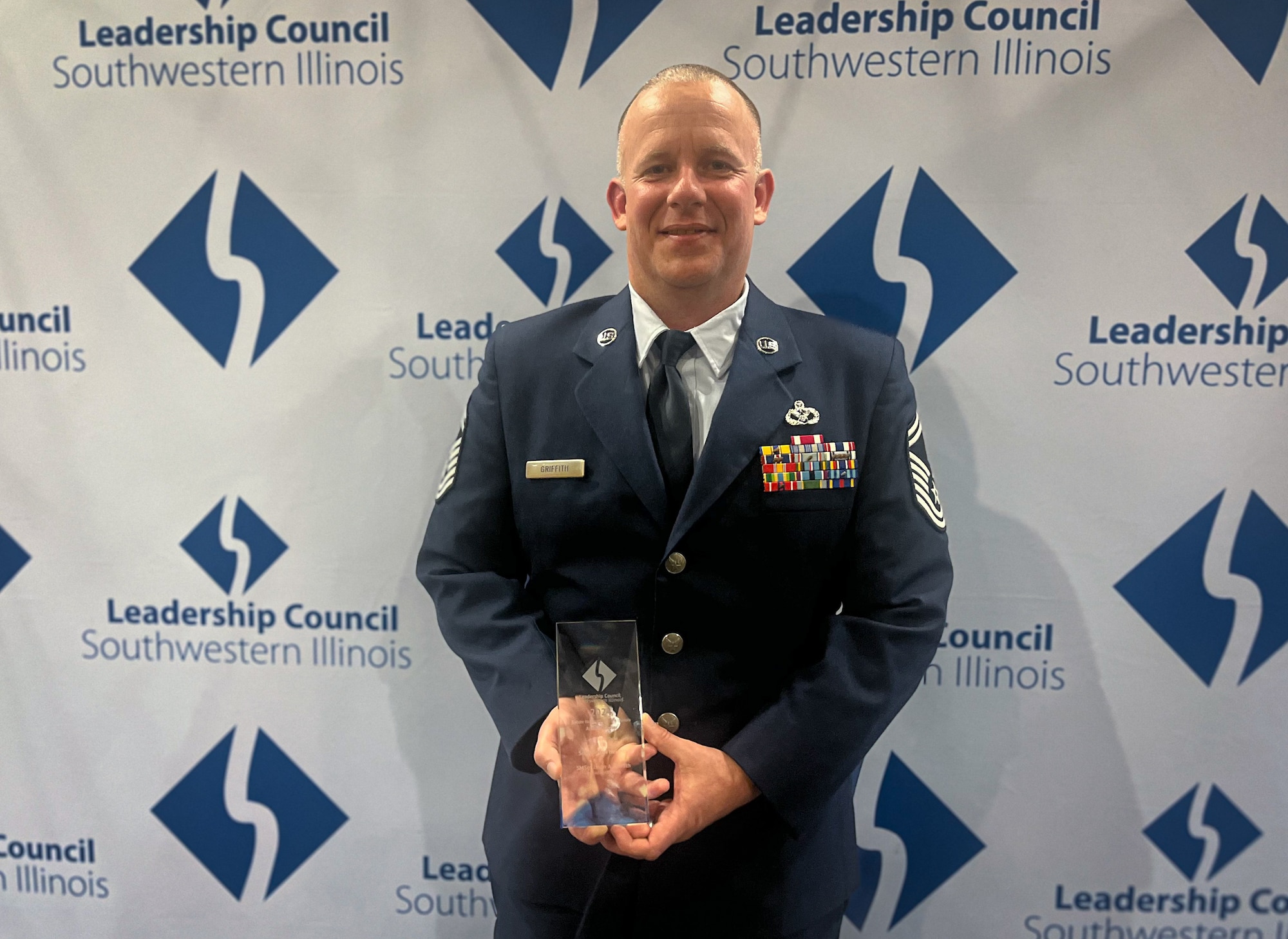 Senior Master Sgt. Jason Griffith, 932nd Civil Engineer Squadron senior enlisted leader, poses with his 2024 Salute to Southwestern Illinois Award for his outstanding contributions to the 932nd Airlift Wing, March 26, 2024, O'Fallon, Illinois. (Photo provided)
