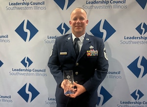 Senior Master Sgt. Jason Griffith, 932nd Civil Engineer Squadron senior enlisted leader, poses with his 2024 Salute to Southwestern Illinois Award for his outstanding contributions to the 932nd Airlift Wing, March 26, 2024, O'Fallon, Illinois. (Photo provided)