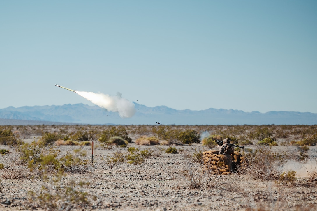 Staff Sgt. Kevin Mott Jr., a low altitude air defense gunner with LAAD Training Section, Air Control Training Squadron, Training Command, coaches a student firing a FIM-92 Stinger during a stinger live-fire exercise as part of Service Level Training Exercise 2-24, March 5, 2024.