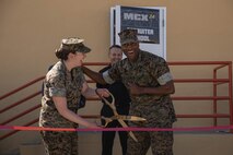 U.S. Marine Corps Brig. Gen. James A. Ryans II, commanding general of Marine Corps Recruit Depot San Diego, right, and Capt. Katherine P. Schumann, executive officer of Basic Recruiter School, left, cut the ribbon to officially open a new 24-hour Marine Corps Exchange at Basic Recruiter School on Marine Corps Recruit Depot San Diego, California, March 19, 2024. The Marine Corps is opening 24-hour self-service stores in efforts to modernize the force and to provide service to the Marines at any time. (U.S. Marine Corps photo by Lance Cpl. Alexandra M. Earl)