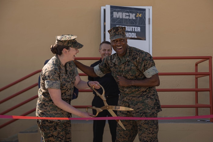 U.S. Marine Corps Brig. Gen. James A. Ryans II, commanding general of Marine Corps Recruit Depot San Diego, right, and Capt. Katherine P. Schumann, executive officer of Basic Recruiter School, left, cut the ribbon to officially open a new 24-hour Marine Corps Exchange at Basic Recruiter School on Marine Corps Recruit Depot San Diego, California, March 19, 2024. The Marine Corps is opening 24-hour self-service stores in efforts to modernize the force and to provide service to the Marines at any time. (U.S. Marine Corps photo by Lance Cpl. Alexandra M. Earl)