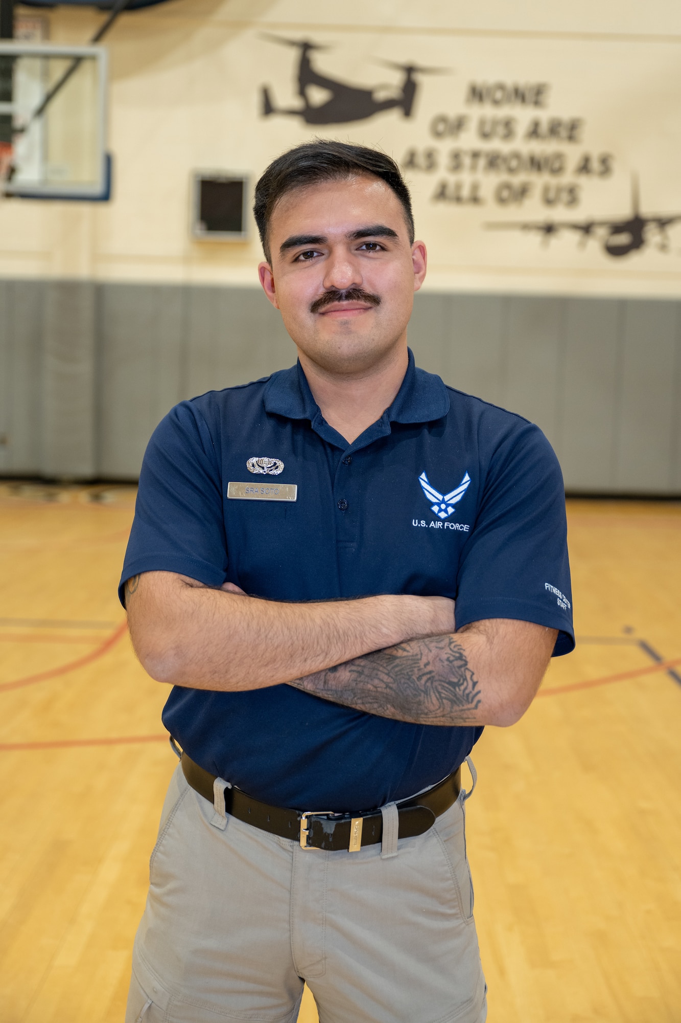 U.S. Air Force Senior Airman Andy Soto, a 1st Special Operations Force Support Squadron fitness specialist, poses for a photo at Hurlburt Field, Florida, Jan. 23, 2024. Soto ensures the physical readiness of Airmen by performing a wide range of duties from managing personnel training contacts to ensuring the upkeep of fitness facilities and leading group physical training activities. (U.S. Air Force photo by Senior Airman Alysa Calvarese)