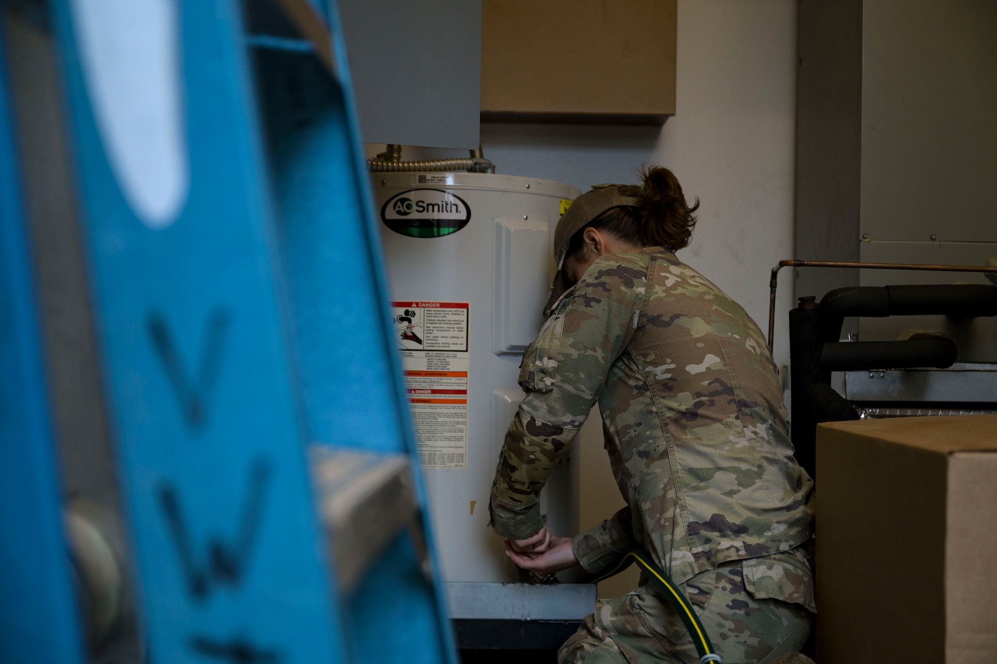 U.S. Air Force Senior Airman Collby Moran, a 1st Special Operations Civil Engineer Squadron water and fuel systems maintenance journeyman, tightens a hose at Hurlburt Field, Florida, March 26, 2024.