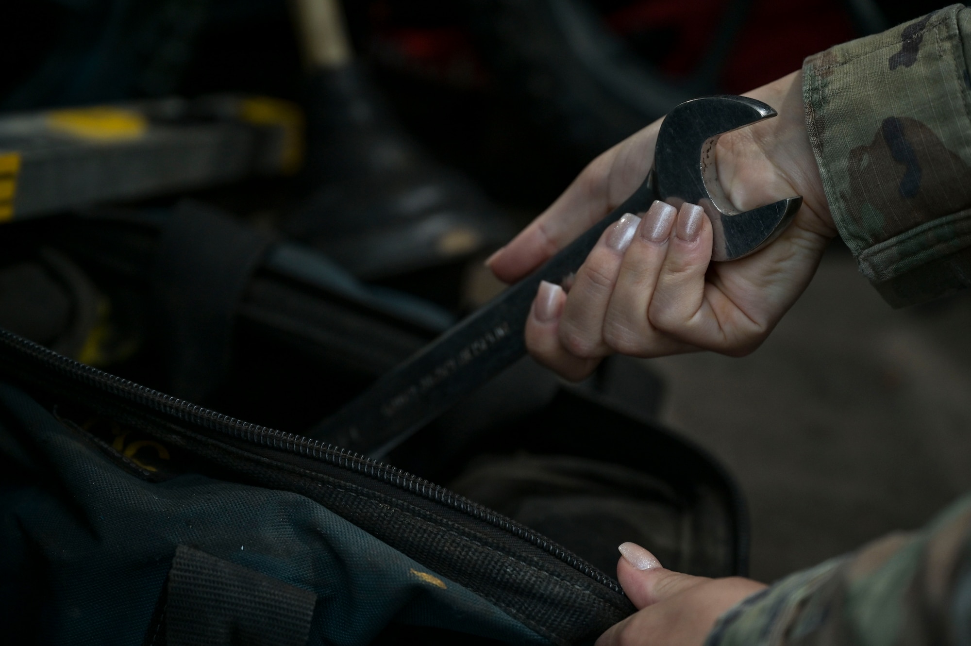 U.S. Air Force Senior Airman Collby Moran, a 1st Special Operations Civil Engineer Squadron water and fuel systems maintenance journeyman, grabs a wrench from her tool kit at Hurlburt Field, Florida, March 26, 2024.