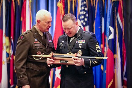 U.S. Army Sgt. 1st Class Robert Williams, right, Washington Army National Guard, receives the Recruiting and Retention Noncommissioned Officer of the Year award from Lt. Gen. Jon Jensen, director of the Army National Guard, at the Director’s Strength Maintenance Awards Conference in Houston March 14, 2024. The conference enabled recruiting and retention Soldiers to network, exchange best practices, and honor the Army National Guard’s best recruiters.