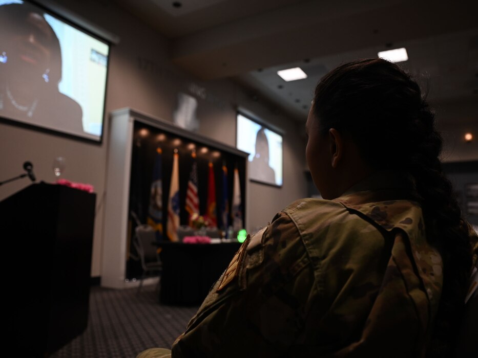 U.S. Air Force Tech. Sgt. Jody McFarland, 17th Contracting Squadron section chief, listens to the keynote speaker, Ret. U.S. Army Maj. Dalmyra Price Caesar, White House Personnel deputy director, during the 17th Training Wing Women’s History Month Panel at the Powell Event Center, Goodfellow Air Force Base, Texas, March 26, 2024. McFarland served as the emcee of the panel for the event, assisting in keeping the conversation between the panel and audience flowing. (U.S. Air Force photo by Airman 1st Class Evelyn J. D’Errico)