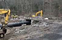 Work recently began to replace the bridge over Indiantown Run that connects Lake Road at Marquette Lake with Asher Miner Road (Route 443) at Fort Indiantown Gap. When completed, the new two-lane bridge will serve as both the entrance and exit for the lake and the Keystone Conference Center, and the road over the Marquette Lake dam that is currently used as the entrance to the lake and the KCC will be closed to vehicular traffic. (Pennsylvania National Guard photo by Brad Rhen)