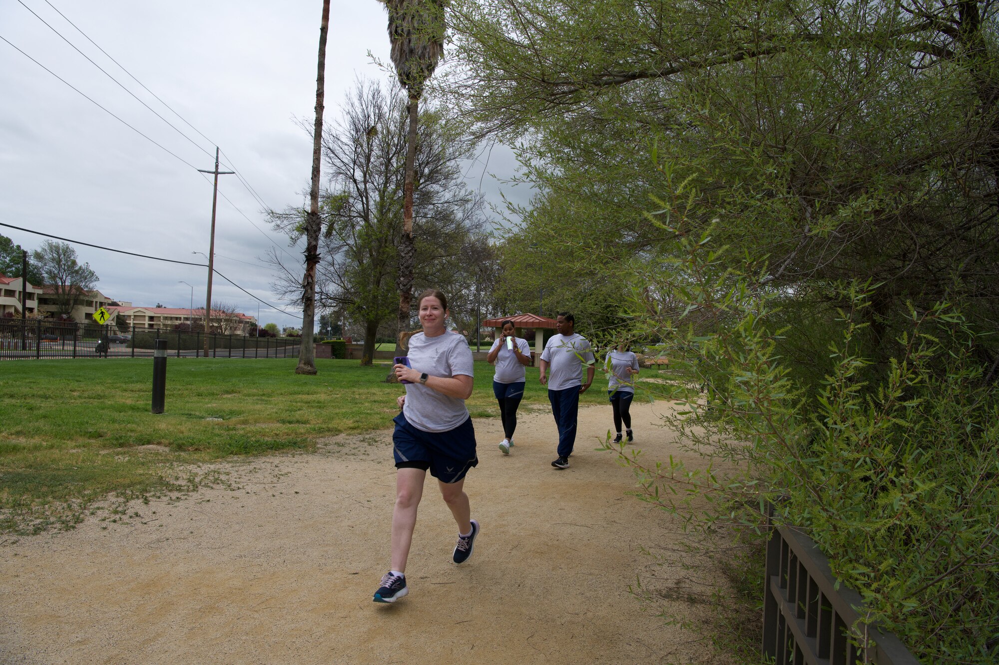 349th FSS members begin the walk and run activities for the physical training session at Travis AFB.