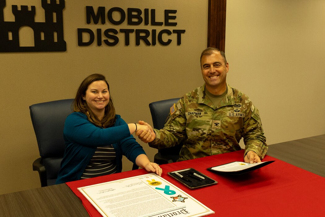 U.S. Army Corps of Engineers, Mobile District Commander Col. Jeremy Chapman and Victim Advocate Maryanna Kuehne signed the 2024 Sexual Assault Awareness Prevention Month Proclamation to begin April's observance of SAAPM at the Mobile District, April 1, 2024.  This year’s Sexual Assault Awareness and Prevention Month, the U.S. Army’s campaign theme is Change Through Unity: Empower. Protect. Prevent. The campaign highlights the importance of fostering a culture of respect for all. (U.S. Army Photo by Jeremy Murray)