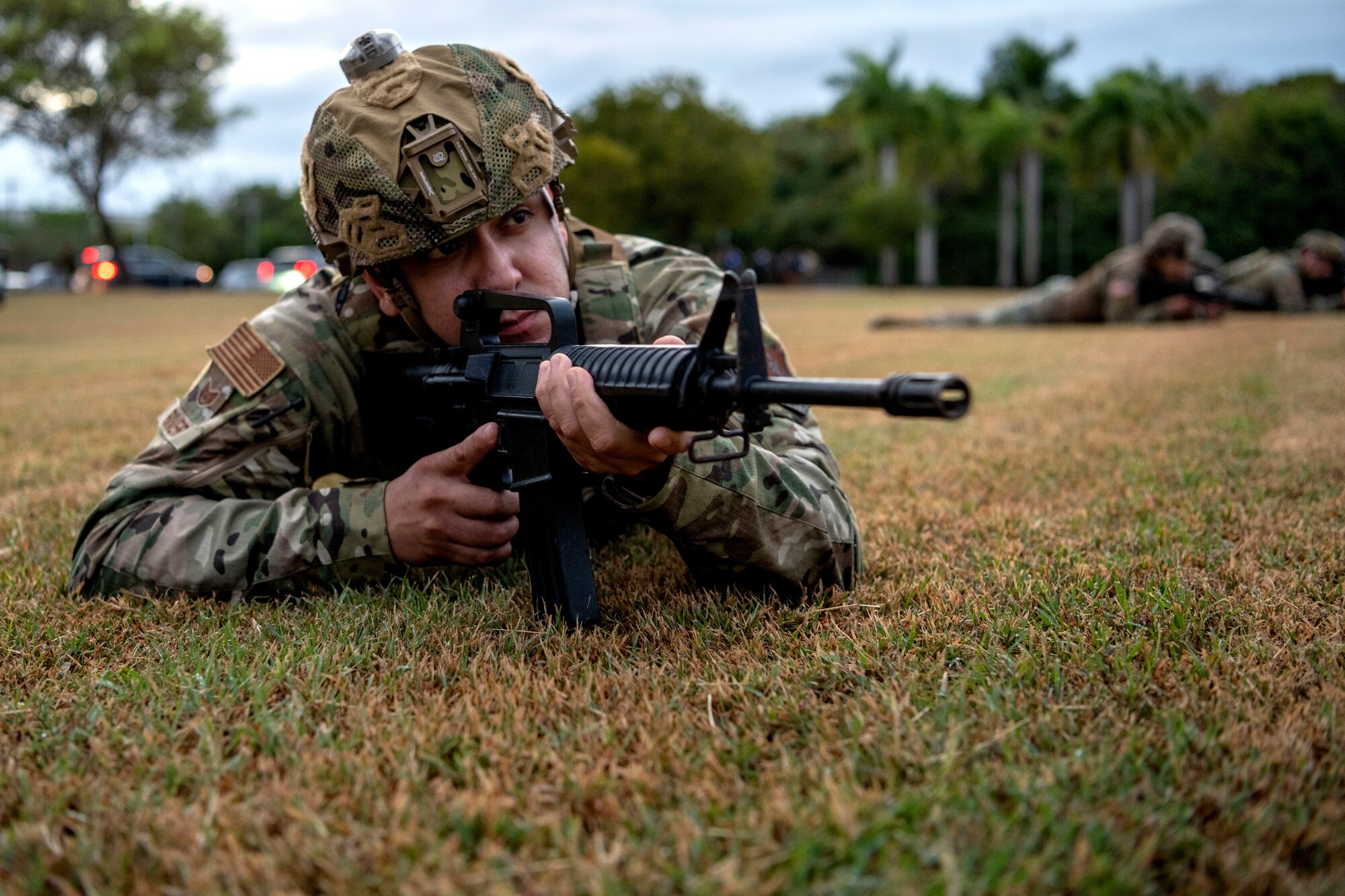 U.S. Air Force Staff Sgt. Nestor Rivera, an aircraft structural maintenance specialist, assigned to the 156th Tactical Advisory Squadron, Puerto Rico Air National Guard, aims his rifle during a joint training non-commissioned officer leadership field exercise at Roosevelt Roads, Ceiba, Puerto Rico, March 15, 2024. The exercise, which included service members with the Puerto Rico Air National Guard, Marine Corps Reserve, Army Reserve, Navy Reserve, and Coast Guard Reserve, allowed participants to develop leadership skills, such as survivability, adaptability, and conflict response during a simulated humanitarian disaster response event. (U.S. Air National Guard photo by Airman 1st Class Marrissa L. Rodriguez)
