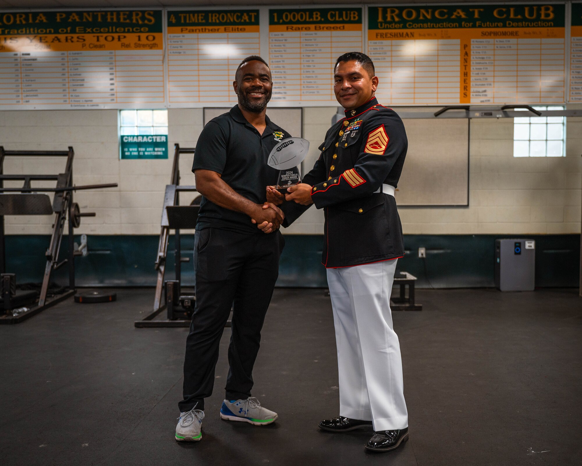 Tech Sgt. Ned McCaster III is awarded the Semper Fidelis Coach Award