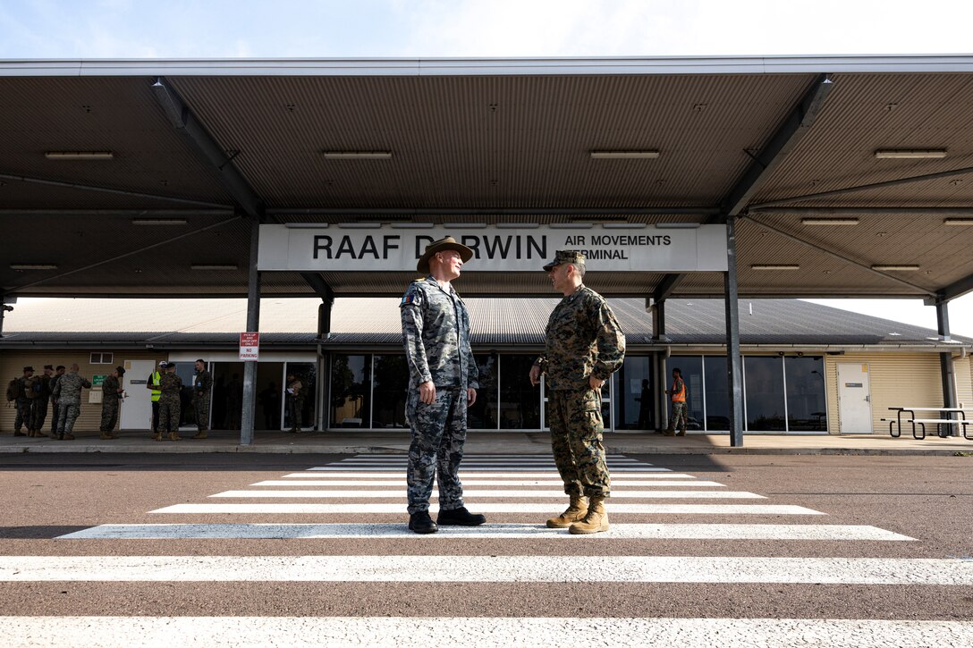U.S. Marine Corps Col. Brian Mulvihill, right, the commanding officer of Marine Rotational Force – Darwin 24.3, meets Royal Australian Navy Capt. Mitchell Livingstone, the commanding officer of Headquarters Northern Command at Royal Australian Air Force Base Darwin, NT, Australia, March 24, 2024. MRF-D 24.3 is part of an annual six-month rotational deployment to enhance interoperability with the Australian Defence Force and Allies and partners and provide a forward-postured crisis response force in the Indo-Pacific. Mulvihill is a native of New York. (U.S. Marine Corps photo by Sgt. Cristian L. Bestul)