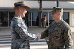 U.S. Marine Corps Col. Brian Mulvihill, right, the commanding officer of Marine Rotational Force – Darwin 24.3, shakes hands with Royal Australian Navy Capt. Mitchell Livingstone, the commanding officer of Headquarters Northern Command at Royal Australian Air Force Base Darwin, NT, Australia, March 24, 2024. MRF-D 24.3 is part of an annual six-month rotational deployment to enhance interoperability with the Australian Defence Force and Allies and partners and provide a forward-postured crisis response force in the Indo-Pacific. Mulvihill is a native of New York. (U.S. Marine Corps photo by Sgt. Cristian L. Bestul)