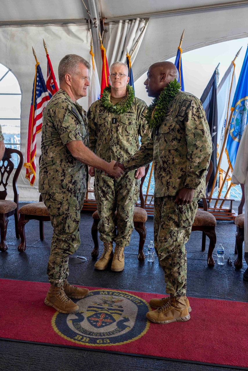 Adm. Samuel Paparo (left), commander, U.S. Pacific Fleet, presides over the transfer of authority ceremony for the Red Hill Bulk Fuel Storage Facility (RHBFSF) between Vice Adm. John Wade (center), outgoing commander, Joint Task Force – Red Hill, and Rear Adm. Steve Barnett (right), commander, Navy Closure Task Force – Red Hill (NCTF-RH), on the Battleship Missouri Memorial in Pearl Harbor, March 28. The ceremony marked the official assumption of responsibility for the RHBFSF by the Navy. NCTF-RH will work with all government agencies and community stakeholders to safely and deliberately close the RHBFSF underground storage tanks and associated piping system, conduct long-term environmental remediation, and ensure continued access to safe drinking water in compliance with all Federal, State, and local laws, policies, and regulations.