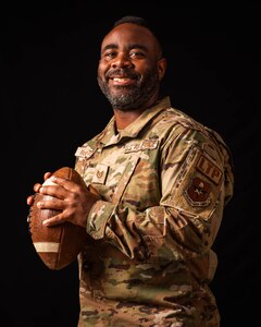 Tech Sgt. Ned McCaster III is awarded the Semper Fidelis Coach Award