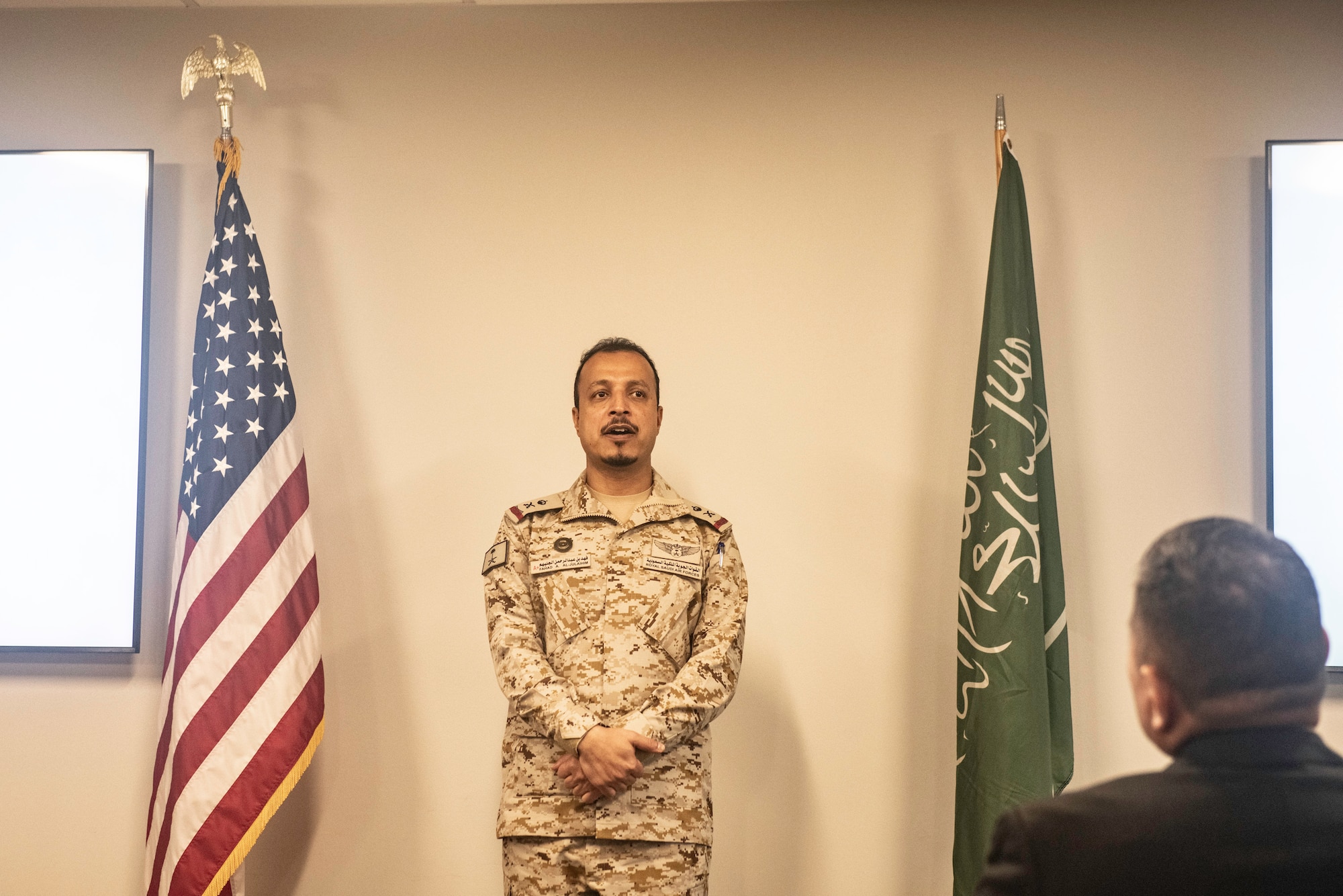 male speaker standing in front of a room
