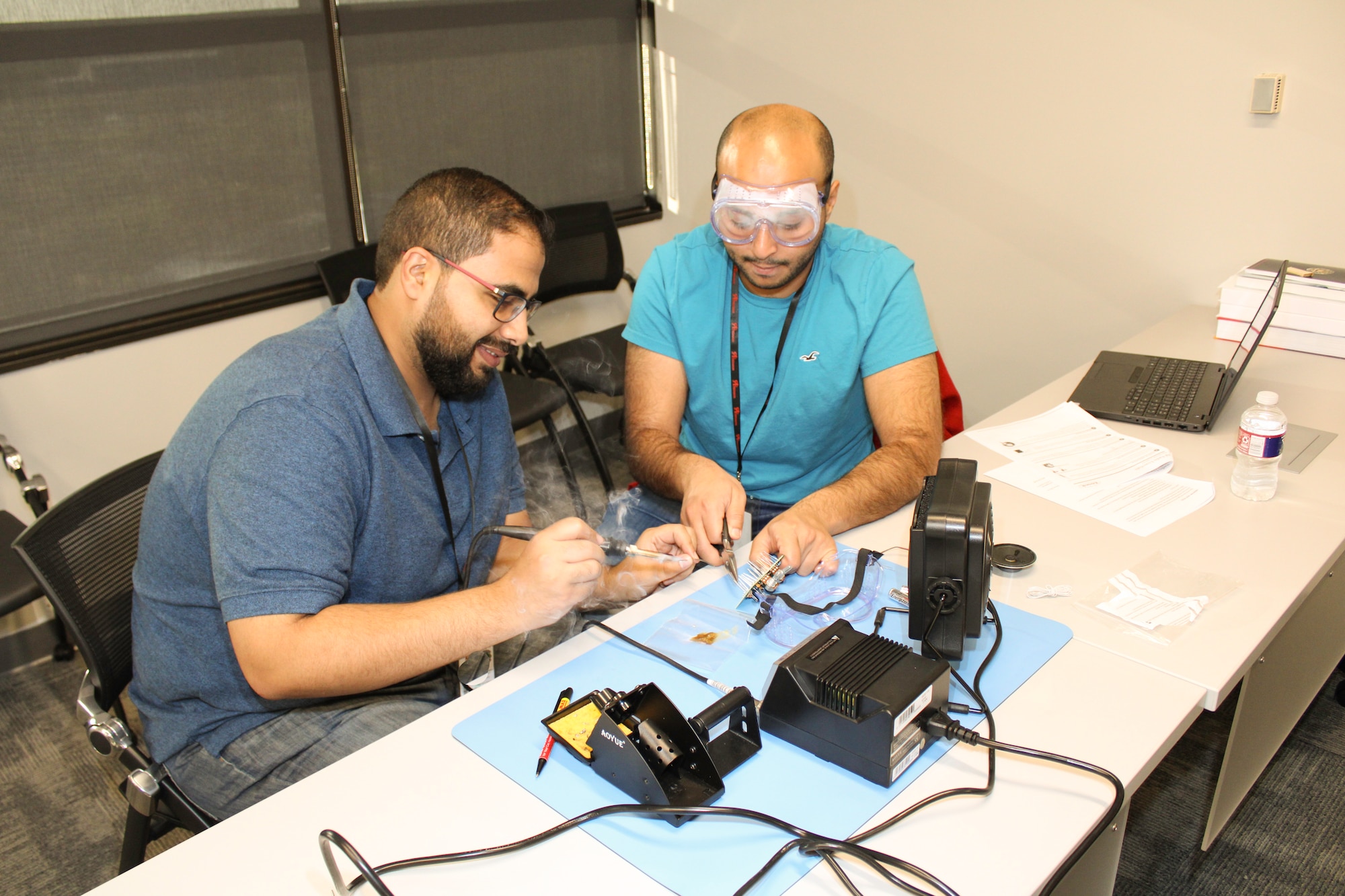 two male students working at a table