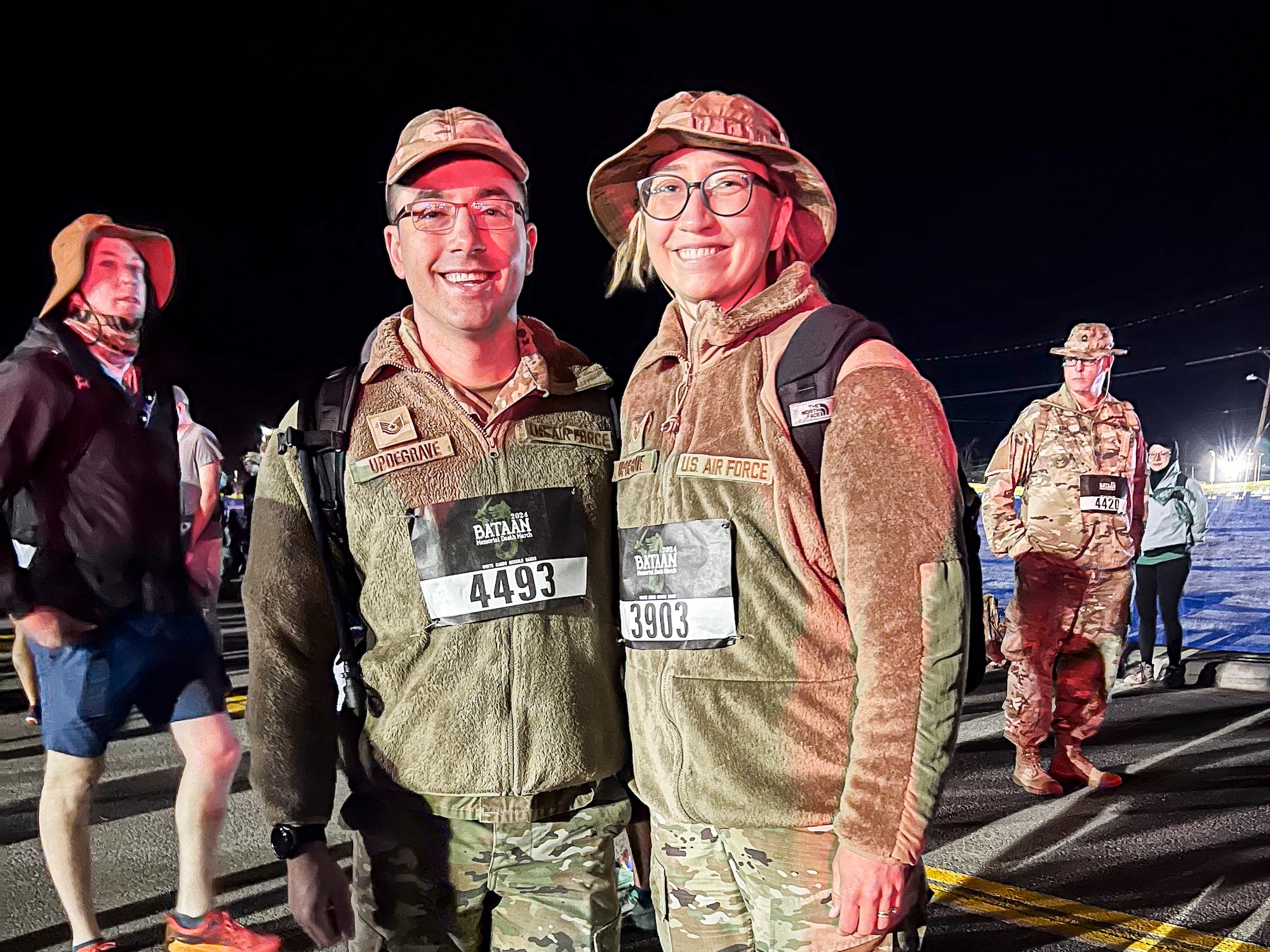 Tech. Sgt. Corey Updegrave, 412th Aircraft Maintenance Squadron, and Staff Sgt. Wendy Updegrave, Flight and Operational Medicine Clinic noncommissioned officer-in-charge, 412th Operational Medical Readiness Squadron, prepare to participate in the Bataan Memorial Death March at White Sands Missile Range, New Mexico, March. 16. (Photo courtesy of Staff Sgt. Wendy Updegrave)