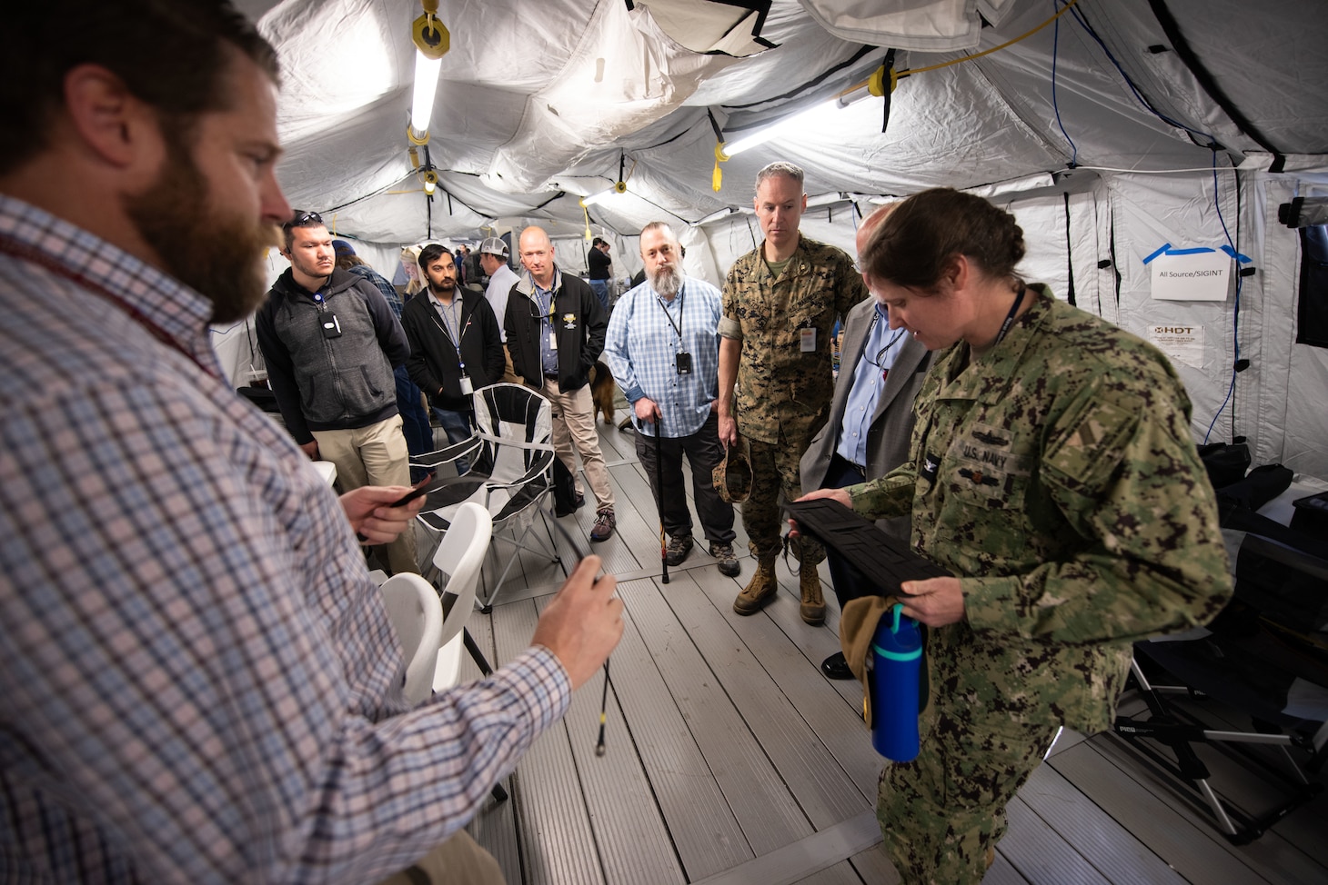 Leaders, subject matter experts and distinguished visitors participated in the System of Systems Naval Integration Experiment at Naval Information Warfare Center (NIWC) Atlantic on March 21, an annual wargaming and experimentation event planned and executed by NIWC Atlantic’s Expeditionary Warfare Department to enhance warfighter-awareness among scientists and engineers by experimenting with systems outside of their typical lab environment.