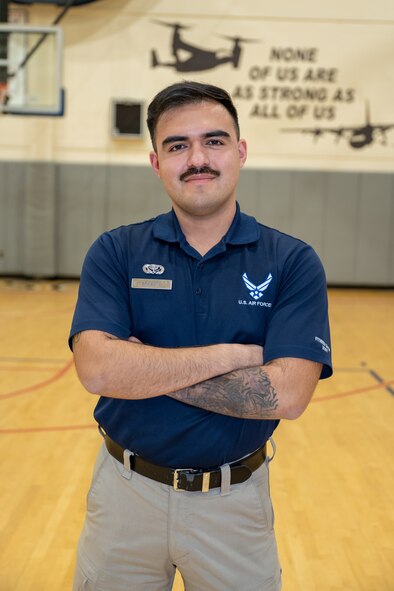 U.S. Air Force Senior Airman Andy Soto, a 1st Special Operations Force Support Squadron fitness specialist, poses for a photo at Hurlburt Field, Florida, Jan. 23, 2024. Soto ensures the physical readiness of Airmen by performing a wide range of duties from managing personnel training contacts to ensuring the upkeep of fitness facilities and leading group physical training activities. (U.S. Air Force photo by Senior Airman Alysa Calvarese)