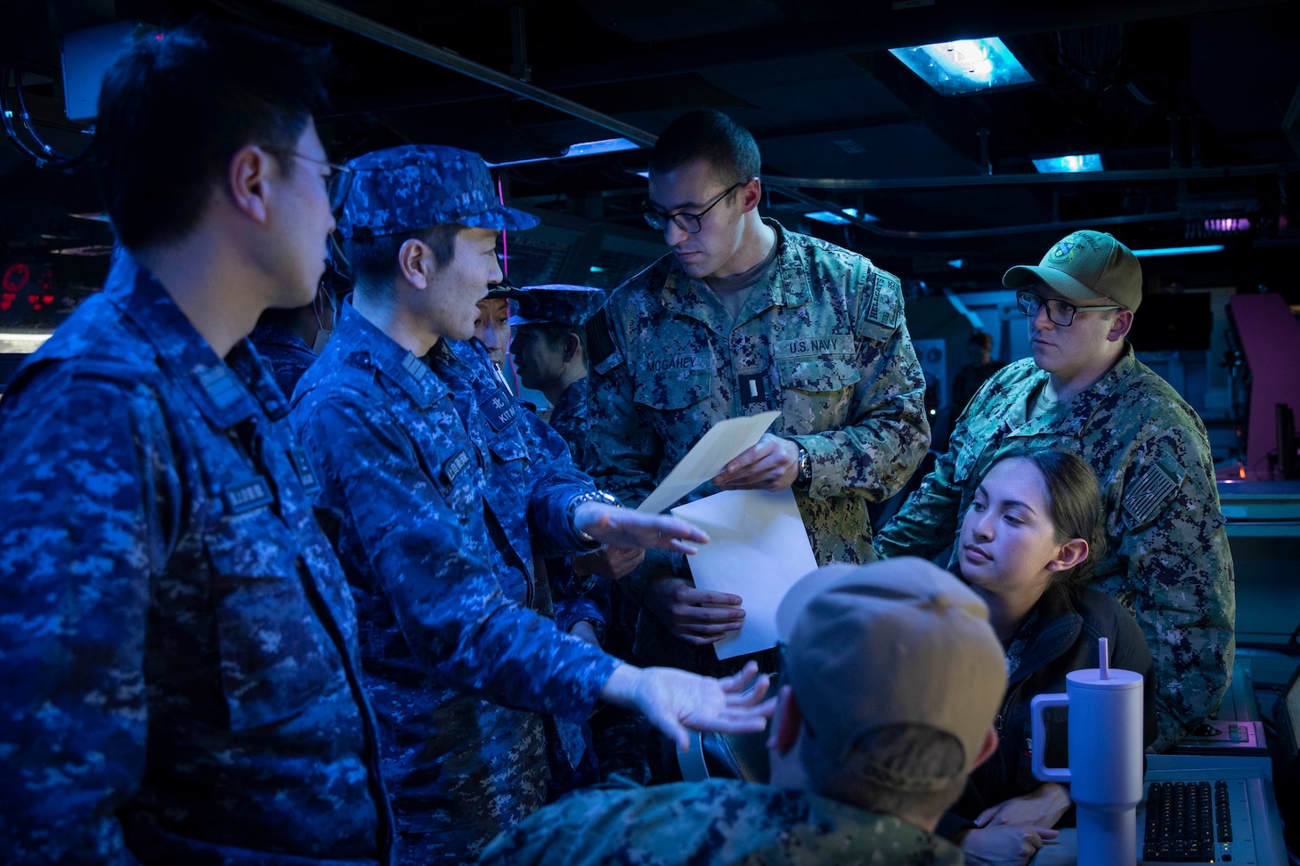 240328-N-SF508-1612 YOKOSUKA, Japan (March 28, 2024) A member of the Japan Maritime Self-Defense Force discusses tomahawk land attack missile (TLAM) procedures with Sailors assigned to the Arleigh Burke-class guided-missile destroyer USS McCampbell (DDG 85), during TLAM training aboard McCampbell at Commander, Fleet Activities Yokosuka, March 28. U.S. 7th Fleet is the U.S. Navy's largest forward-deployed numbered fleet, and routinely interacts and operates with allies and partners in preserving a free and open Indo-Pacific region. (U.S. Navy Photo by Mass Communication Specialist 1st Class Charles Oki)