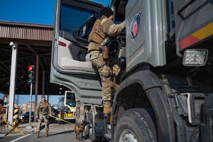 U.S. Air Force elite guards assigned to the 51st Security Forces Squadron stand watch and guard the entrance to the installation at Osan Air Base, Republic of Korea, March 21, 2024. While security forces Defenders typically handle patrols and traditional law enforcement duties, elite guards specialize solely in installation access and control. This unique, advanced training ensures Osan AB is safeguarded to the highest standard. (U.S. Air Force photo by Senior Airman Brittany Russell)