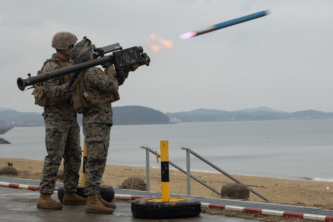 U.S. Marine Corps Cpl. Johnathan Saechao, a low altitude air defense gunner, with 3rd Low Altitude Air Defense Battalion, 3rd Marine Air Wing, fires a Stinger Trainer Launch Simulator during Warrior Shield 24 on Daecheon Firing Range, Republic of Korea March 5, 2024. Warrior Shield 24 is an annual joint, combined exercise held on the Korean Peninsula that seeks to strengthen the combined defensive capabilities of ROK and U.S. forces. This routine, regularly scheduled, field training exercise provides the ROK and U.S. Marines the opportunity to rehearse combined operations, exchange knowledge, and demonstrate the strength and capabilities of the ROK-U.S. Alliance. Saechao is a native of California. (U.S. Marine Corps photo by Lance Cpl. Jeffrey Pruett)